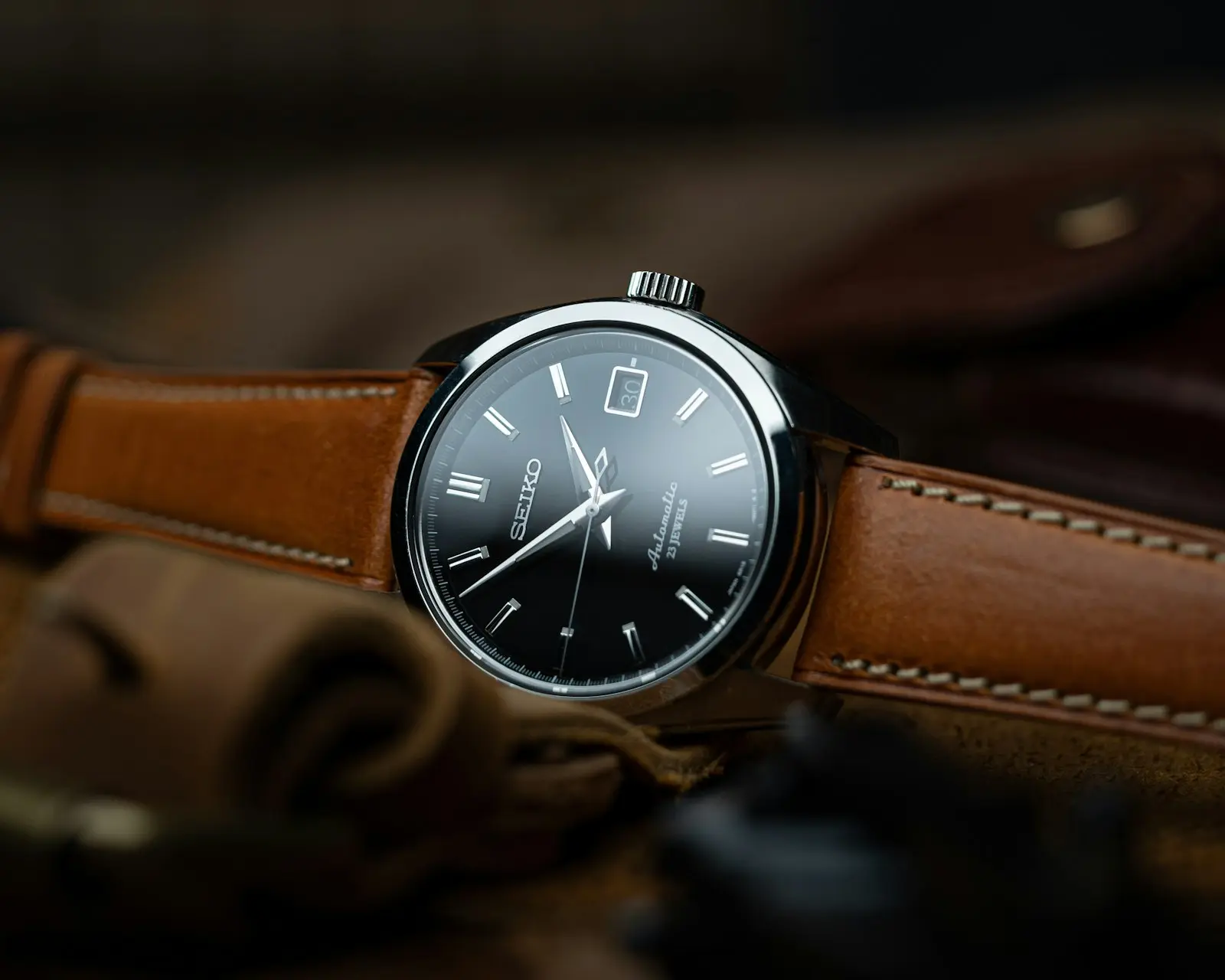 A wristwatch with a brown leather strap
