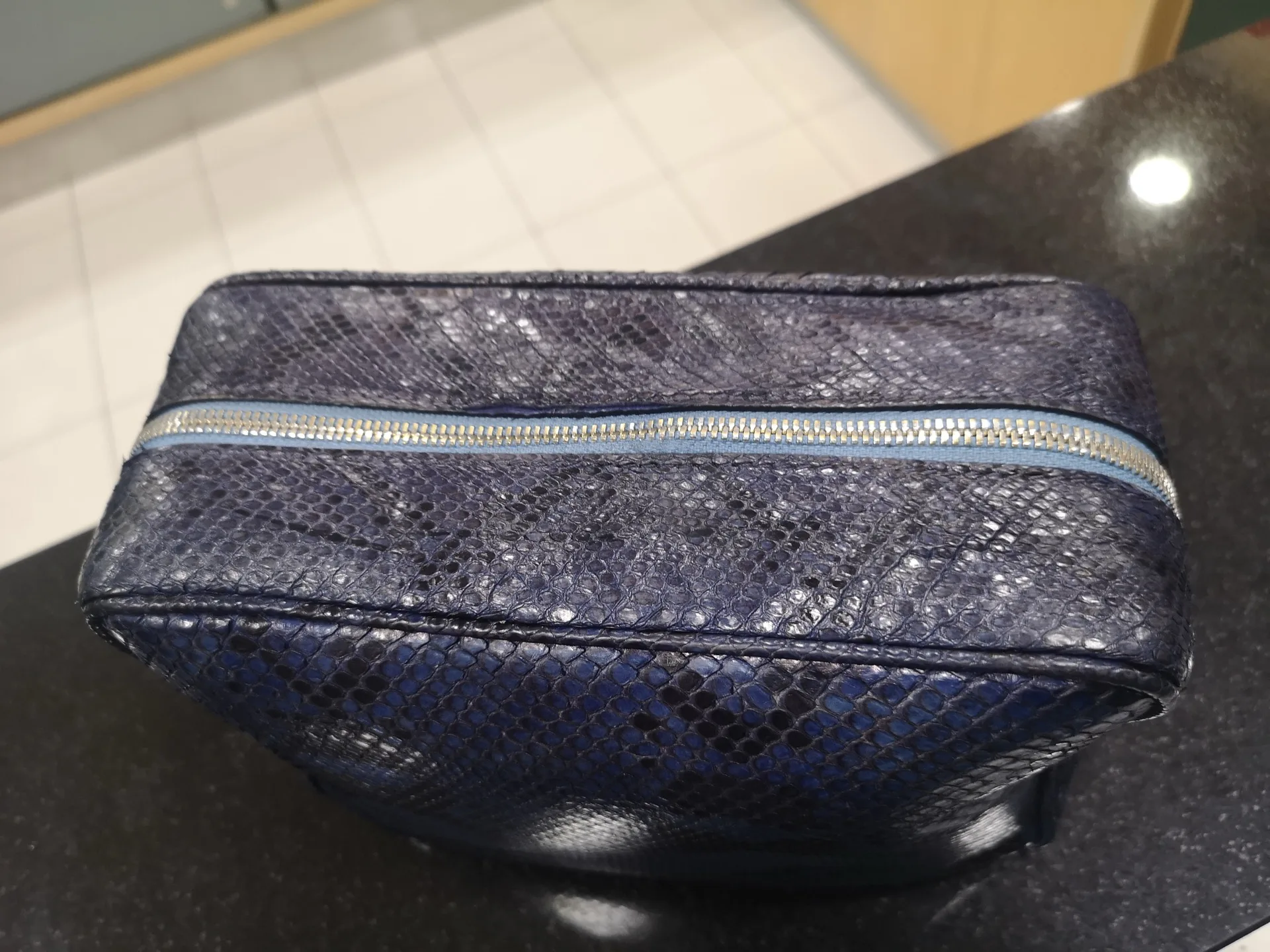 Exotic leather pouch showing fine hand craftsmanship