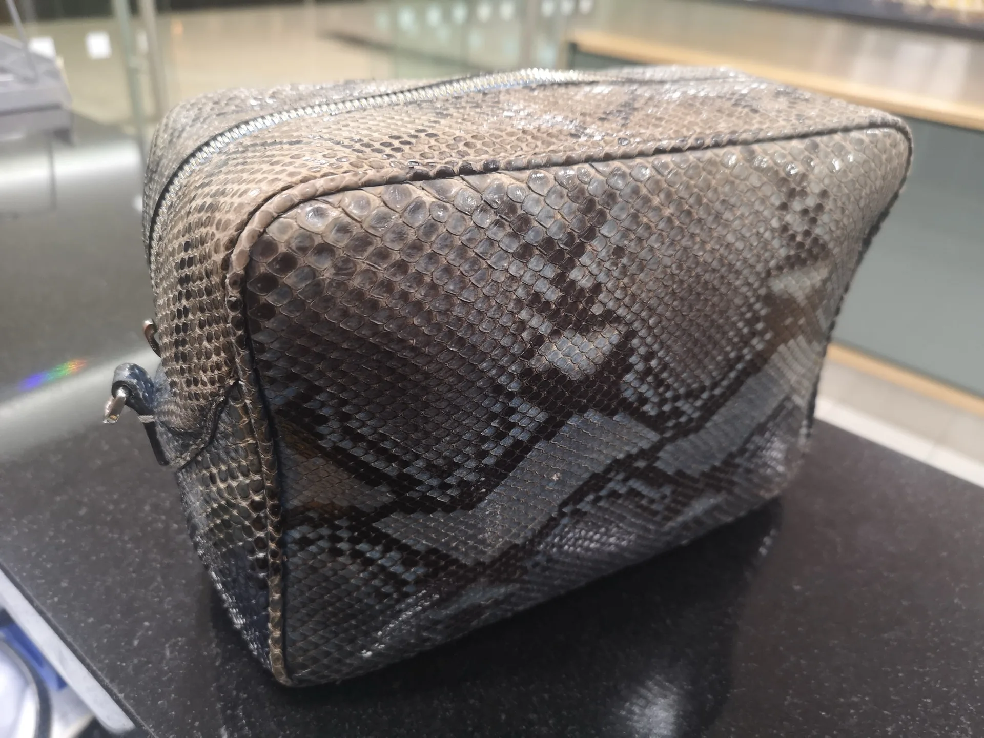 Python leather cosmetic bag after repair